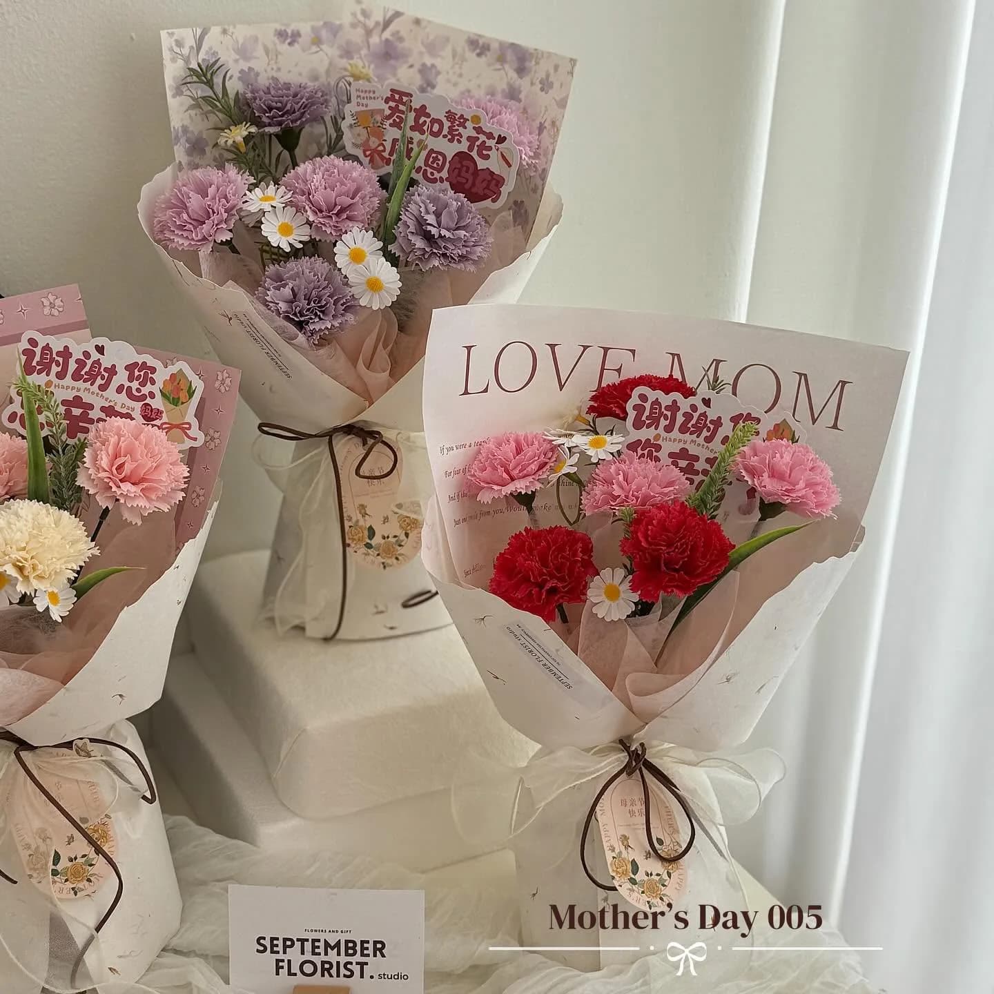 A Mother's Day arrangement of carnations in pink and lilac